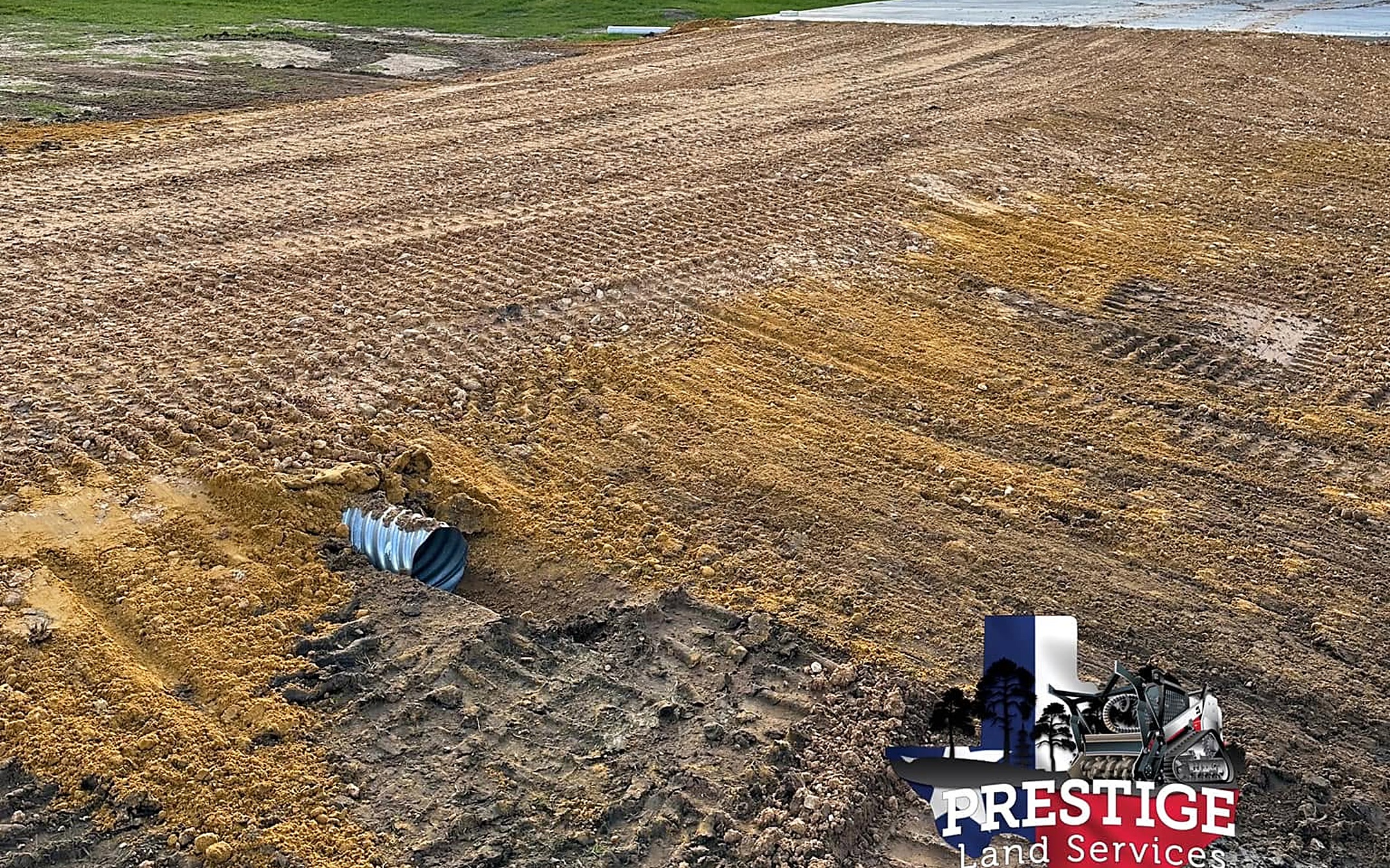 Graded building pad and drainage work on a Fort Bend County property near Fulshear, Texas